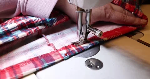 Sew red and blue checkered pattern using sewing machine Stock Footage 285840249