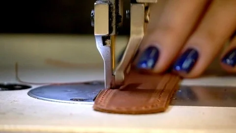 Sew the skin strap, sewing machine detail in slow motion, leather craft Stock-Footage 118136148