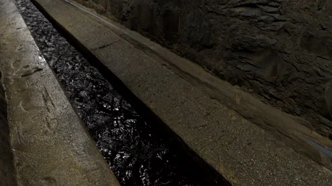 Sewage canal in which a small stream flows. Video stock 327789421