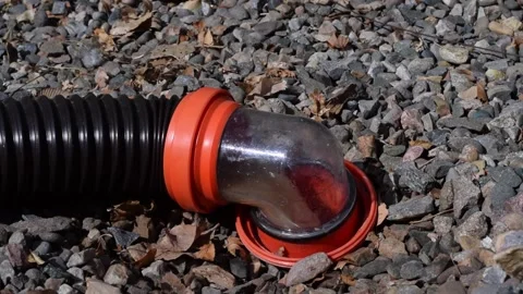 Sewage draining through rv hose Stock Footage 148348518