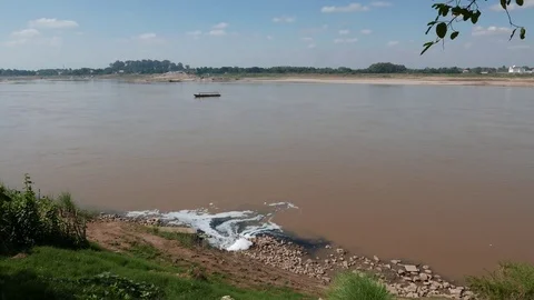 Sewage drains unthreated polluted waters into the Mekong River Stock Footage 70850587