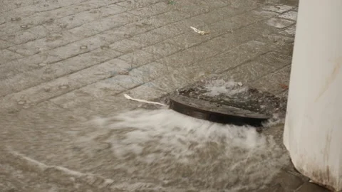 Sewage overflow during rain top view Stock Footage 146014431