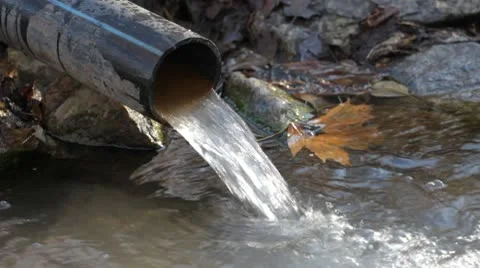 Sewage pipe polluting the river Stock Footage 8986015
