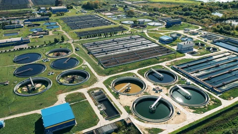 Sewage treatment complex filmed in a top view. Water treatment plant from above. Stock Footage