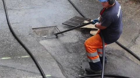 Sewer cleaning in progress Stock Footage 246124439