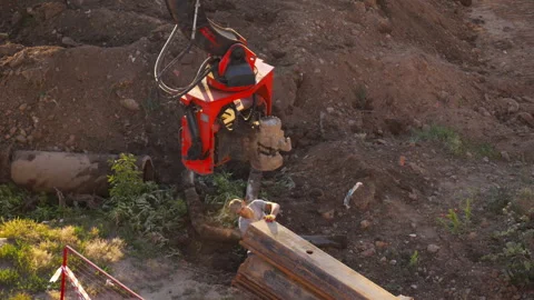 Sewer collector repair worker operating in construction trench Stock Footage 345363906