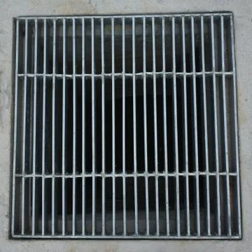 Sewer grate on roadside Stock Photos