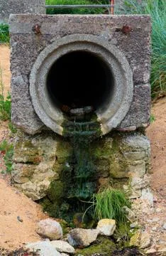 Sewer pipe on the beach Stock-Fotos