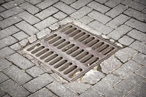 Sewer in a street Stock Photos
