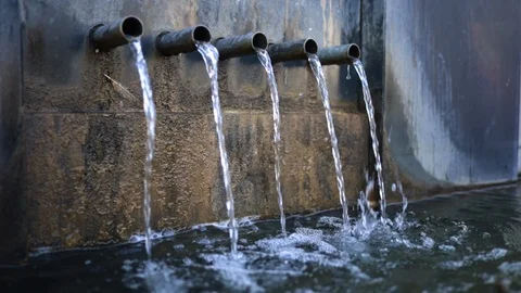 Sewer water flows from several thin pipes Stock Footage 117046606