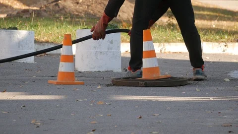 Sewer workers in action Stock Footage 100192020