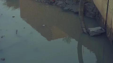Sewerage water suction pipe and motor, Suction pipe dip in the sewerage Stock Footage 101565457