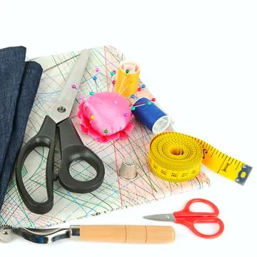 Sewing accessories and paper pattern isolated on white background.Top view. F Stock Photos