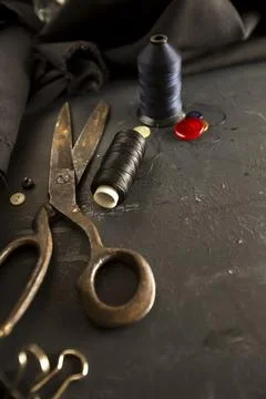 Sewing accessories: scissors, threads, needles. Tailor concept. Stock Photos