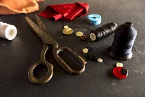  Sewing accessories: scissors, threads, needles. Tailor concept. Stock Photos