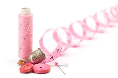 Sewing accessories: thread, needle and thimble Stock Photos