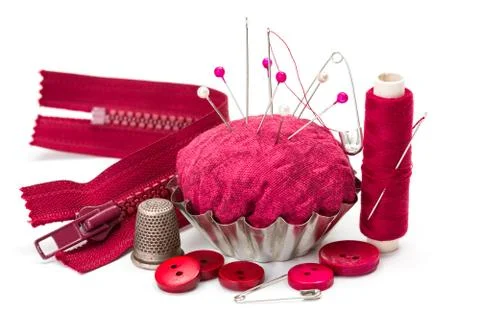 Sewing accessories: thread, needle, thimble and pincushion Stock Photos