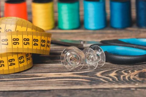 Sewing background with color threads, meter and scissors Stock Photos
