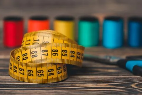 Sewing background with color threads, meter and scissors Stock Photos