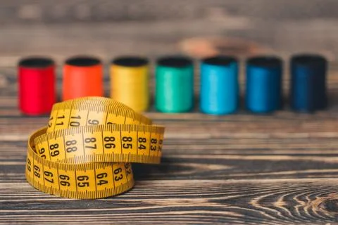 Sewing background with color threads, meter and scissors Stock Photos