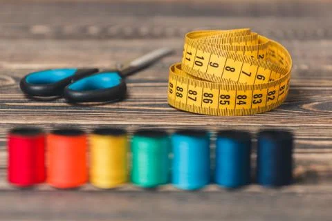 Sewing background with color threads, meter and scissors Stock Photos