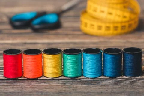 Sewing background with color threads, meter and scissors Stock Photos