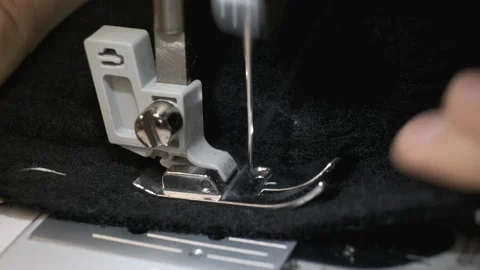 Sewing black fabric with sewing machine Stock Footage 115336548