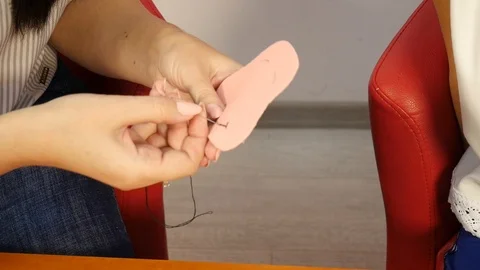 Sewing black thread to fabric Stock Footage 115522993