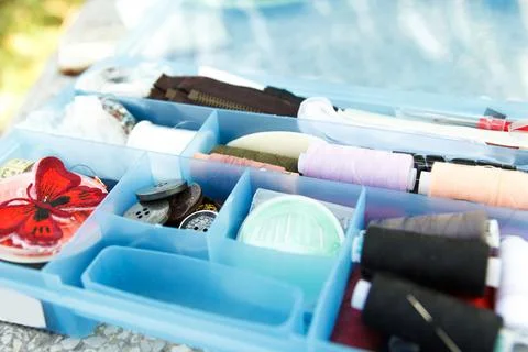 Sewing box with threads, needles and buttons Stock Photos