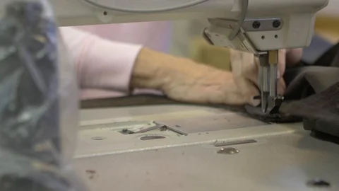 Sewing Brown Fabric with Camera Slide Video stock 100852329