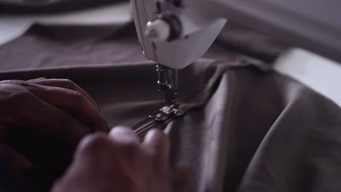 Sewing Brown Fabric Close Up Video stock 104814692