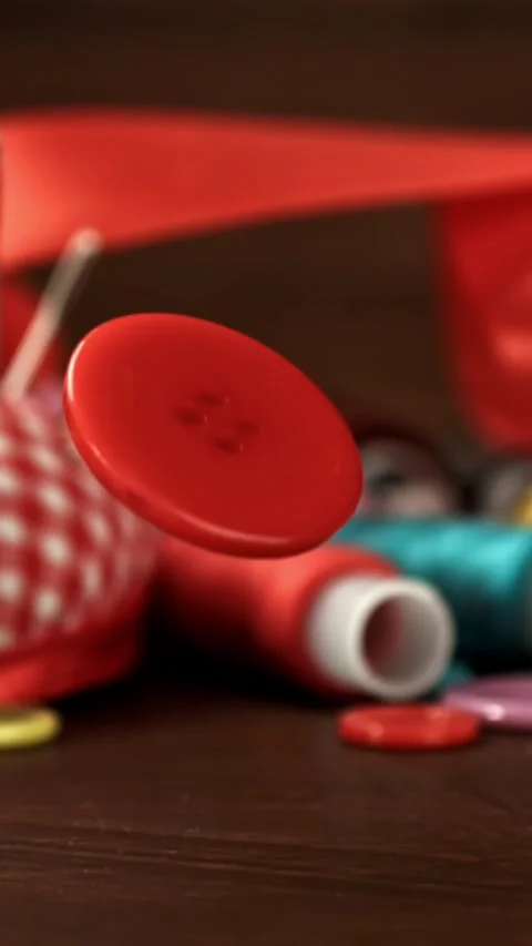 A sewing button falls on the table. Filmed on a high-speed camera at 1000 fps Stock Footage 335367357