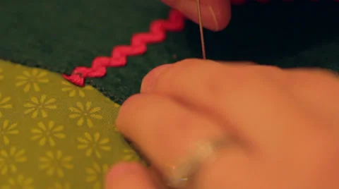 Sewing on a button Stock Footage 32639745