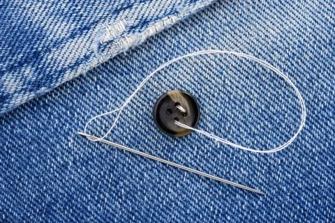 Sewing a button 写真素材