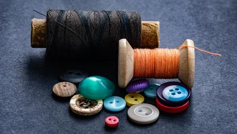 Sewing buttons and thread spool Stock Photos