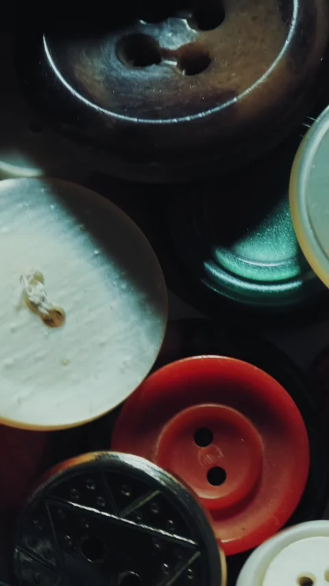 Sewing buttons. close-up. rotation. Various round colored sewing buttons rotate 動画素材 319777882