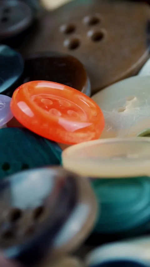 Sewing buttons. close-up. rotation. Various round colored sewing buttons rotate Stock Footage 320611104