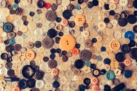 Sewing buttons of different size amd colors on isolated background. Stock Photos