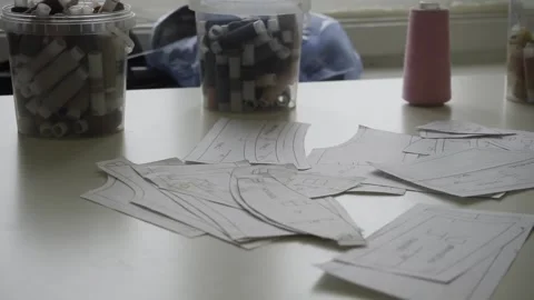 Sewing clippings and spools of thread Stock Footage 159881533