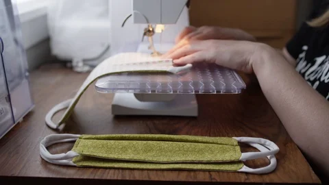 Sewing cloth masks to control spread of covid-19 Stock Footage 128160259