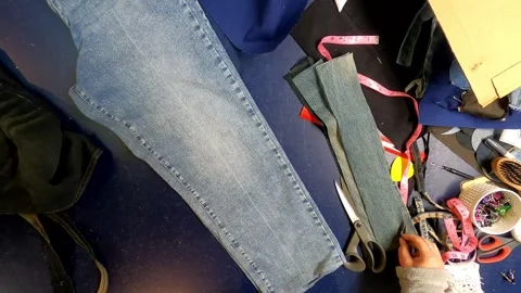 Sewing Cloth thread sewing machine scissors cutting creating Stock Footage 320025439