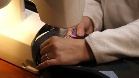 Sewing Cloth thread sewing machine scissors cutting creating Stock Footage 320033600