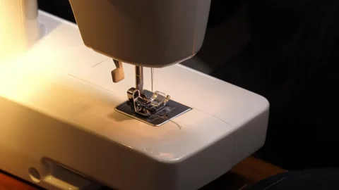 Sewing Cloth thread sewing machine scissors cutting creating Stock Footage 320034149