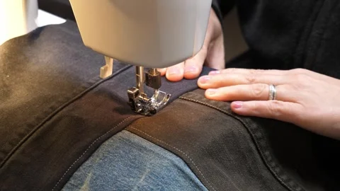 Sewing Cloth thread sewing machine scissors cutting creating Stock Footage 320034811