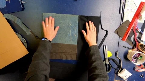 Sewing Cloth thread sewing machine scissors cutting creating Stock Footage 320036675