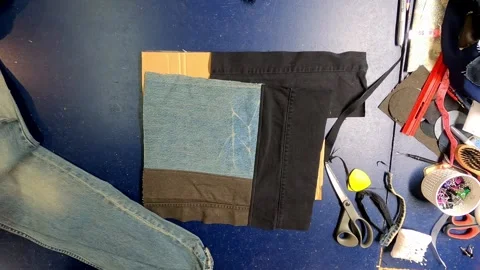 Sewing Cloth thread sewing machine scissors cutting creating Stock Footage 320037898