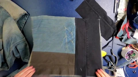 Sewing Cloth thread sewing machine scissors cutting creating Stock Footage 320038405