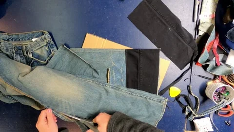 Sewing Cloth thread sewing machine scissors cutting creating Stock Footage 320039018