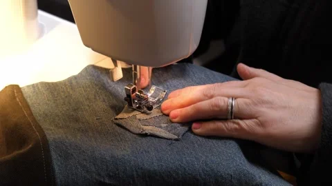 Sewing Cloth thread sewing machine scissors cutting creating Stock Footage 320042992
