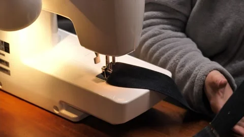 Sewing Cloth thread sewing machine scissors cutting creating Stock Footage 320050607